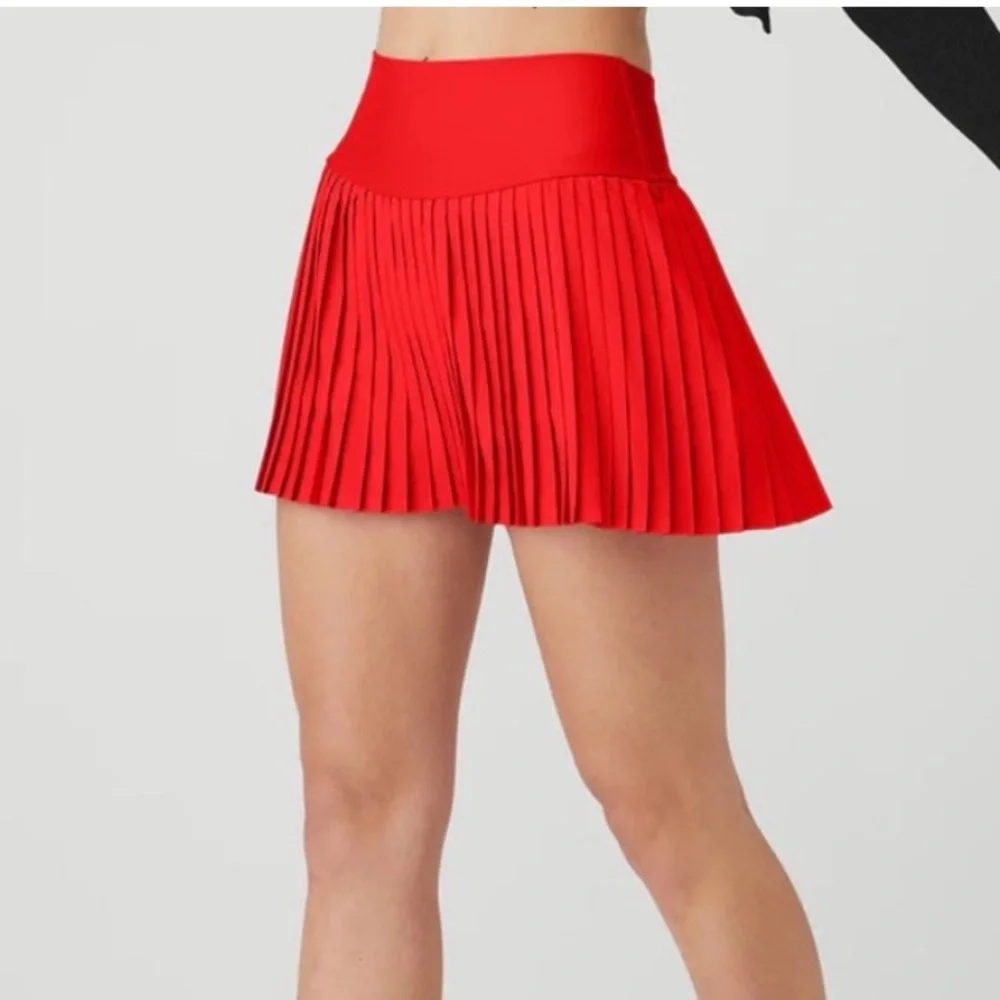 Red pleated also tennis skirt